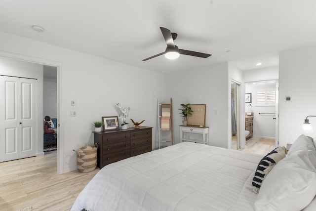 bedroom with baseboards, light wood-type flooring, ensuite bath, and recessed lighting