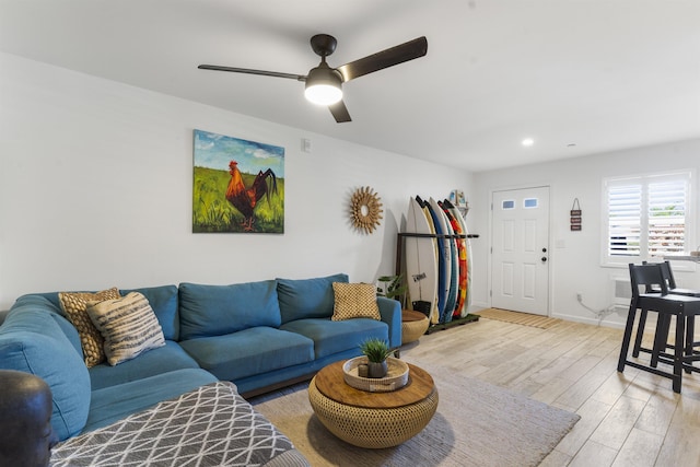 living room with light wood-style flooring, baseboards, ceiling fan, and recessed lighting