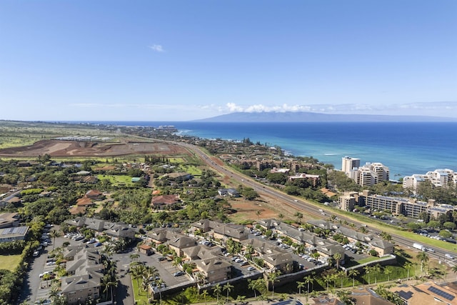 birds eye view of property with a water view and a view of city