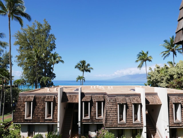 view of building exterior with a water view