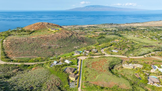 drone / aerial view with a water and mountain view