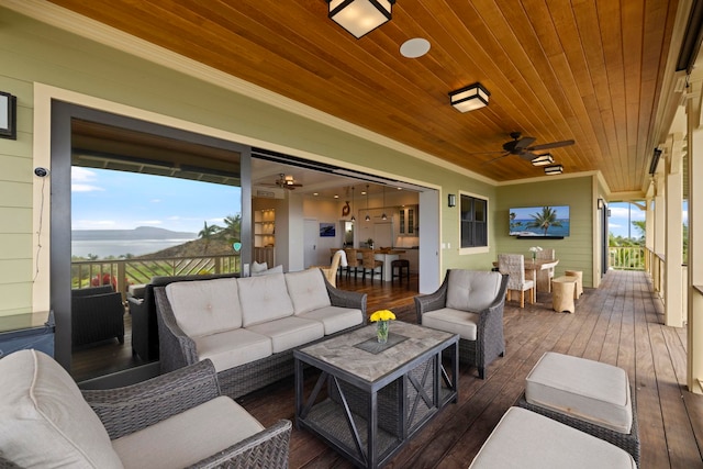 deck featuring an outdoor hangout area and a ceiling fan