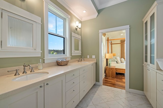 bathroom with vanity, crown molding, and a shower