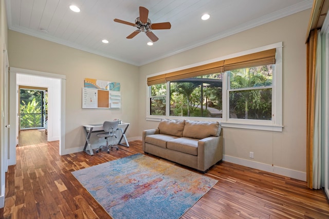 living room with hardwood / wood-style flooring, a healthy amount of sunlight, ornamental molding, and ceiling fan