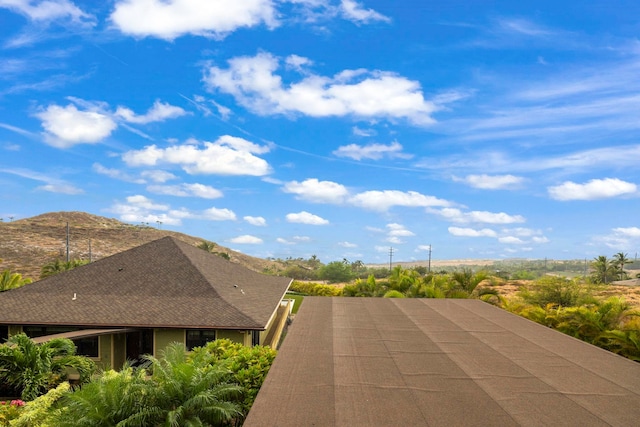 view of property exterior with a mountain view