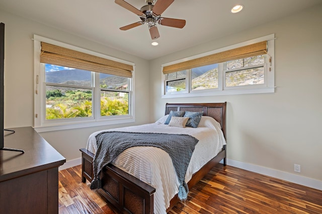 bedroom with dark wood-type flooring and ceiling fan