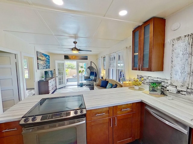 kitchen with ceiling fan, stainless steel appliances, and french doors