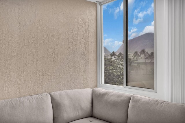 111 Kahului Beach Rd Unit D402, Kahului, HI 96732 - living area with healthy amount of natural light and a textured wall