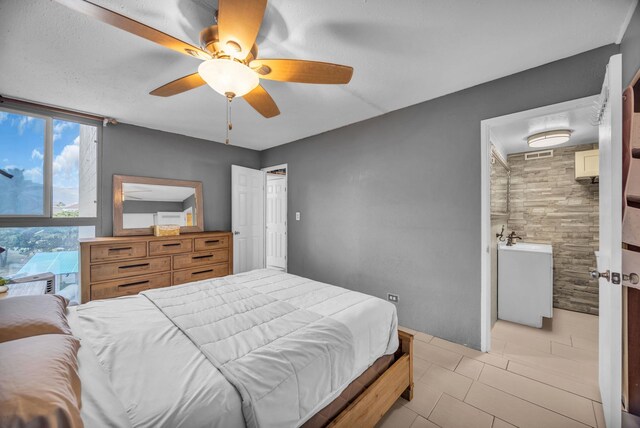 111 Kahului Beach Rd Unit D402, Kahului, HI 96732 - bedroom featuring ceiling fan and light tile patterned floors