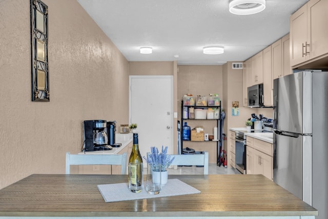 111 Kahului Beach Rd Unit D402, Kahului, HI 96732 - kitchen featuring stainless steel appliances and a textured wall