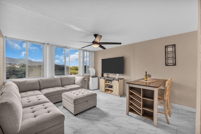 111 Kahului Beach Rd Unit D402, Kahului, HI 96732 - living room with light marble finish floors and a ceiling fan
