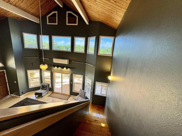 hall with hardwood / wood-style flooring, high vaulted ceiling, beam ceiling, and wood ceiling