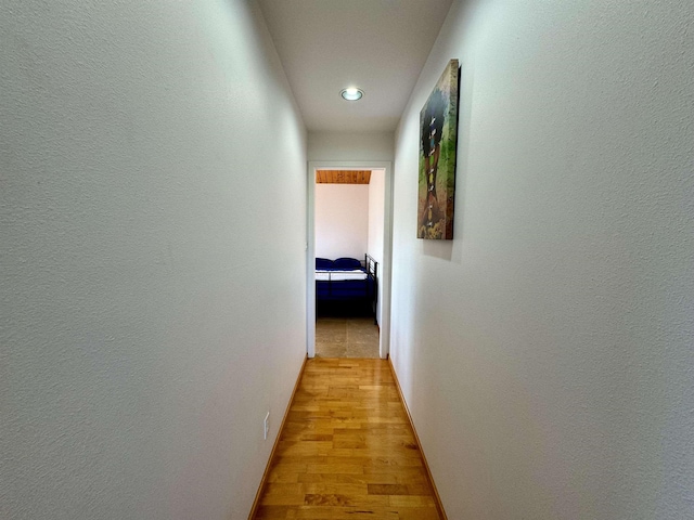 corridor featuring light hardwood / wood-style floors