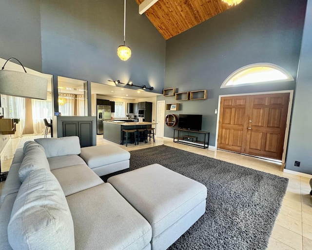 living room featuring high vaulted ceiling, wooden ceiling, and light tile patterned flooring