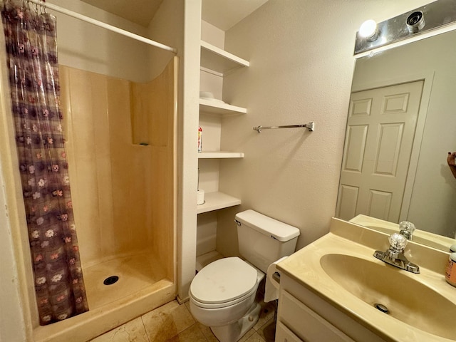 bathroom with a shower with curtain, toilet, tile patterned floors, and vanity