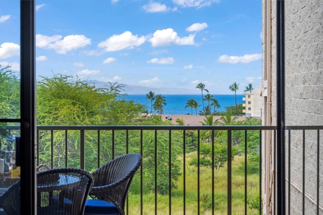 balcony featuring a water view