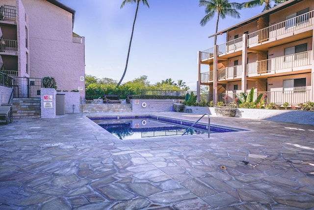 view of swimming pool featuring a patio