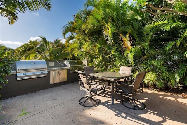 45 Kai Ala Dr Unit A409, Lahaina, HI 96761 - view of patio featuring grilling area, area for grilling, and outdoor dining space