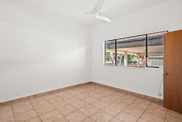 tiled empty room with ceiling fan and cooling unit