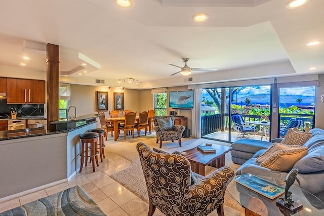 150 Puukolii Rd Unit 18, Lahaina, HI 96761 - living area with recessed lighting, light tile patterned floors, a tray ceiling, and a ceiling fan