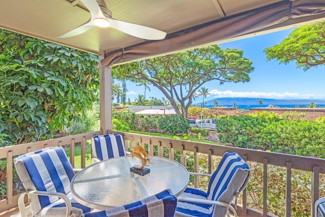150 Puukolii Rd Unit 18, Lahaina, HI 96761 - balcony with a ceiling fan, outdoor dining space, and a water view