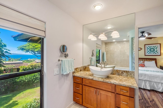 150 Puukolii Rd Unit 18, Lahaina, HI 96761 - ensuite bathroom featuring vanity, a shower, a water view, and baseboards