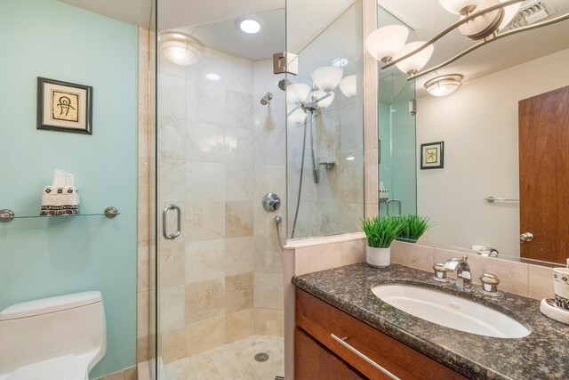 150 Puukolii Rd Unit 18, Lahaina, HI 96761 - bathroom featuring a stall shower, vanity, and toilet