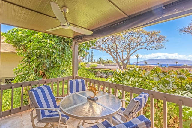 150 Puukolii Rd Unit 18, Lahaina, HI 96761 - wooden terrace featuring outdoor dining area and a ceiling fan
