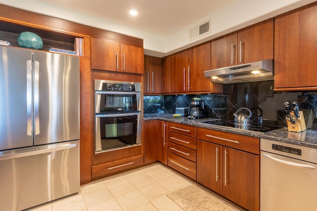 150 Puukolii Rd Unit 18, Lahaina, HI 96761 - kitchen with appliances with stainless steel finishes, under cabinet range hood, backsplash, and dark stone counters