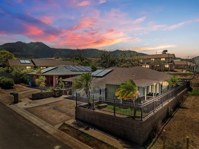 980 Kuhio Pl, Wailuku, HI 96793 - ranch-style house featuring a mountain view, concrete driveway, and roof mounted solar panels