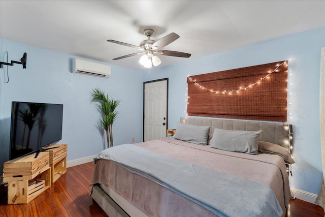 980 Kuhio Pl, Wailuku, HI 96793 - bedroom with an AC wall unit, baseboards, wood finished floors, and ceiling fan