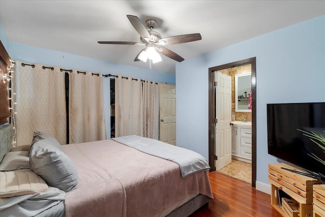 980 Kuhio Pl, Wailuku, HI 96793 - bedroom with wood finished floors, connected bathroom, a ceiling fan, and baseboards