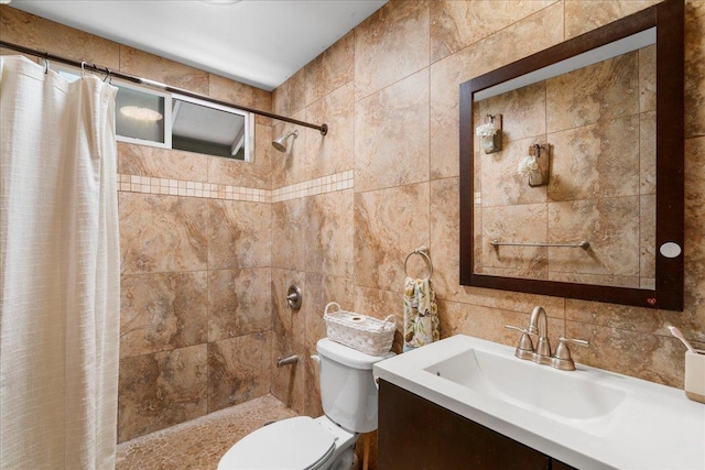 980 Kuhio Pl, Wailuku, HI 96793 - bathroom with tile walls, toilet, tiled shower, and vanity