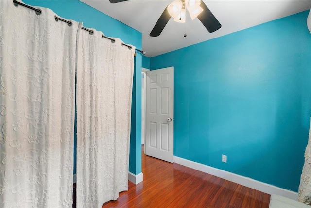 980 Kuhio Pl, Wailuku, HI 96793 - unfurnished room with a ceiling fan, wood finished floors, and baseboards