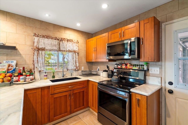 980 Kuhio Pl, Wailuku, HI 96793 - kitchen featuring appliances with stainless steel finishes, a sink, light countertops, tasteful backsplash, and recessed lighting