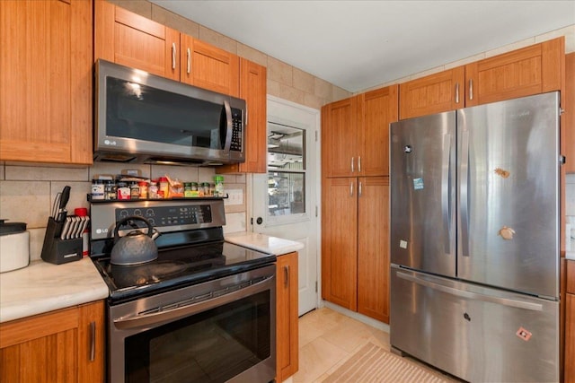980 Kuhio Pl, Wailuku, HI 96793 - kitchen with stainless steel appliances, light countertops, and tasteful backsplash