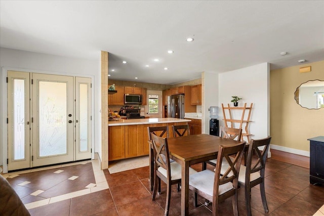 980 Kuhio Pl, Wailuku, HI 96793 - dining area featuring dark tile patterned floors, recessed lighting, and baseboards