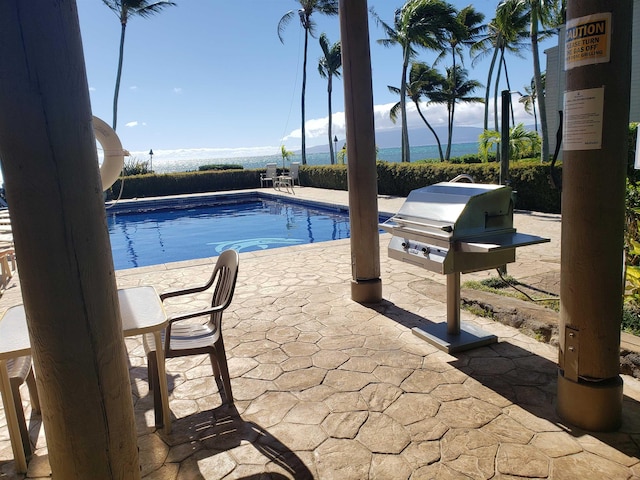 view of pool featuring a patio area and a mountain view