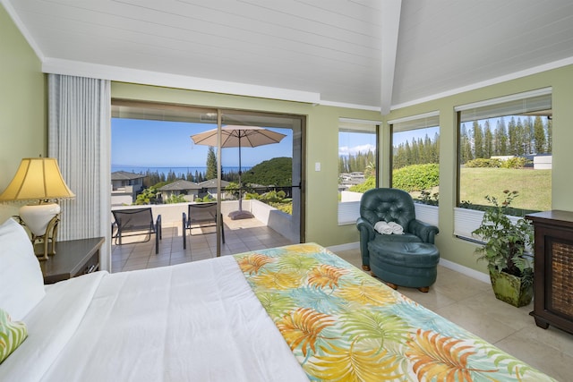 tiled bedroom with ornamental molding and access to outside