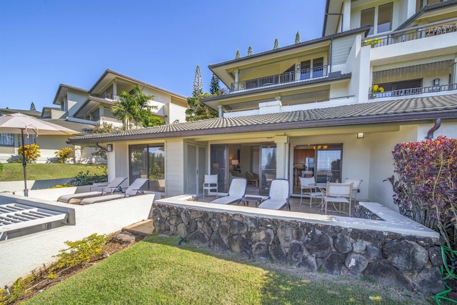 back of house with a patio