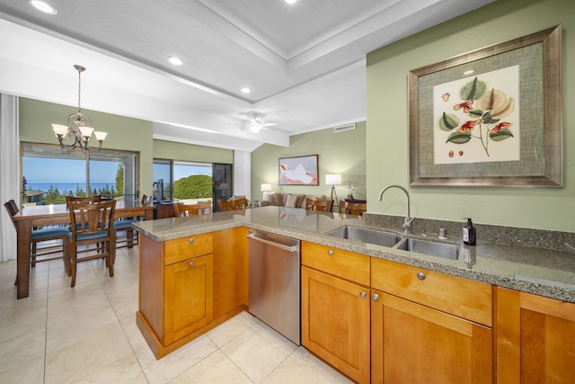 kitchen with kitchen peninsula, ceiling fan with notable chandelier, sink, pendant lighting, and dishwasher