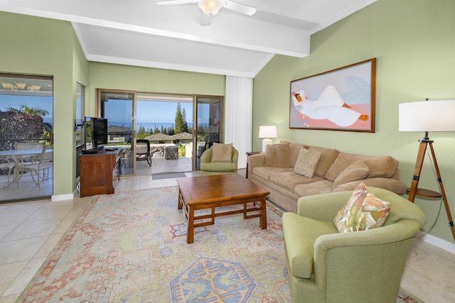 living room featuring light tile patterned floors, vaulted ceiling with beams, and ceiling fan