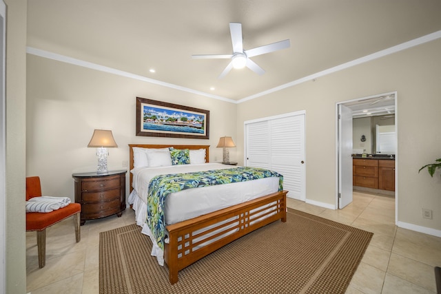 bedroom with ornamental molding, ceiling fan, connected bathroom, a closet, and light tile patterned flooring