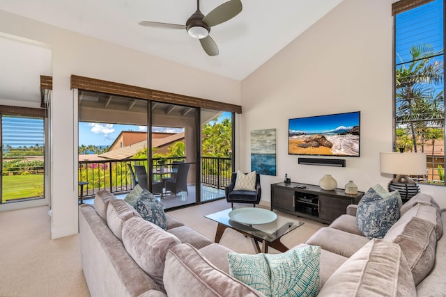 living room with light carpet, high vaulted ceiling, and ceiling fan