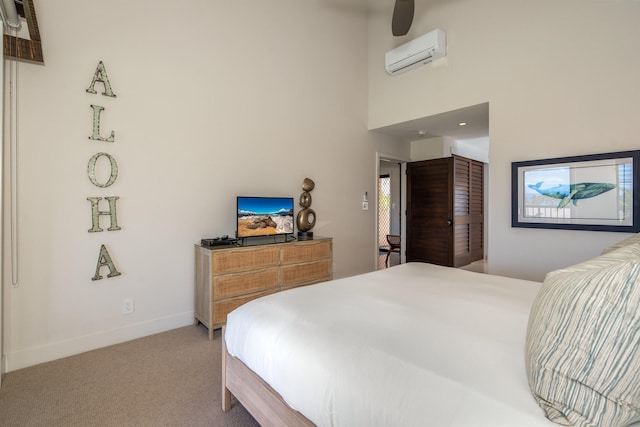 carpeted bedroom with a towering ceiling, an AC wall unit, and ceiling fan