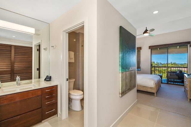 bathroom featuring tile patterned floors, ceiling fan, toilet, and vanity