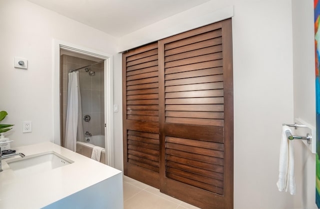 bathroom featuring shower / bath combo, tile patterned floors, and sink