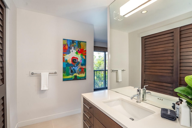 bathroom with tile patterned floors and vanity