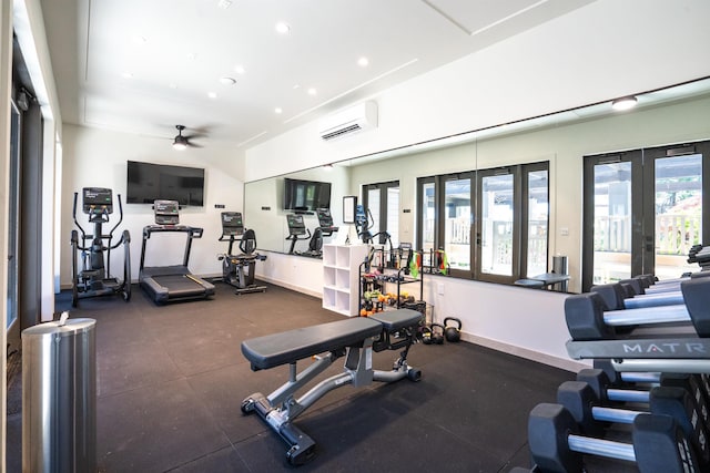 workout area with a wall mounted AC, ceiling fan, and french doors