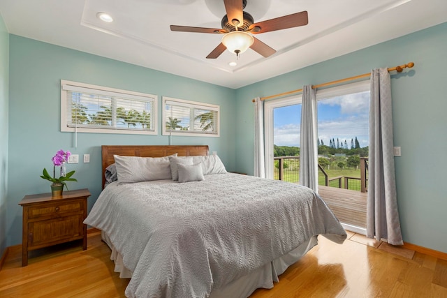 bedroom with ceiling fan and light wood-type flooring